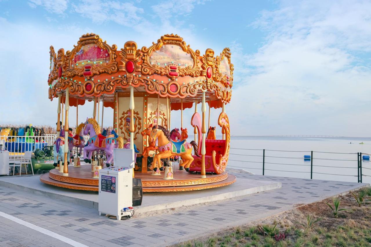 Lagoona Beach Luxury Resort And Spa Al Manamah Esterno foto A carousel in Pattaya, Thailand